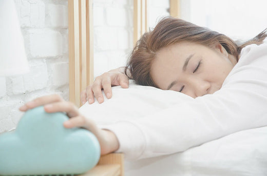 lady sleeping on mlily bed