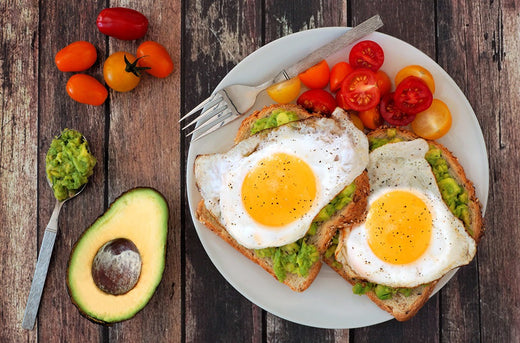fried eggs on a avacado toast