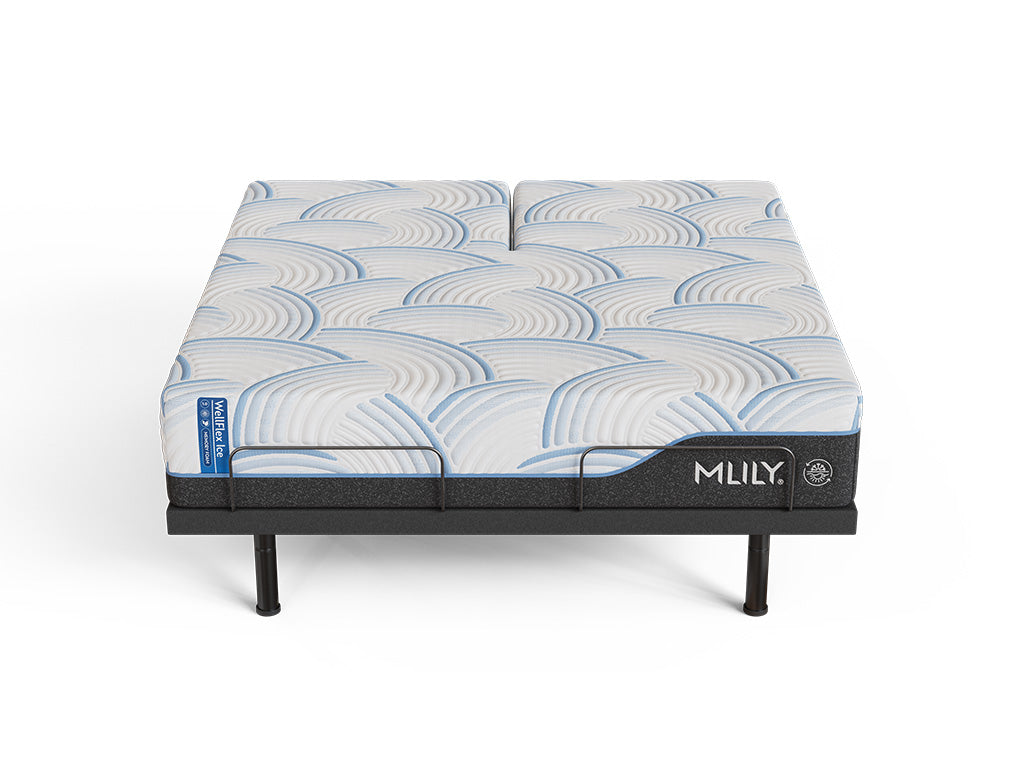 WellFlex ICE Split Head King mattress lying flat on an MS300 adjustable base, showing the split head sections and connected lower surface.
