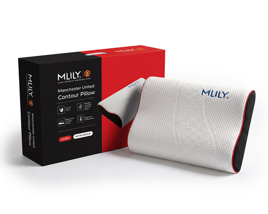 MLILY Manchester United Contour Pillow in white with red trim, shown next to its black and red retail packaging box on a white background.
