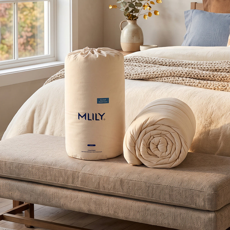 MLILY EcoSoft Duvet sitting in front of a made bed in the fall
