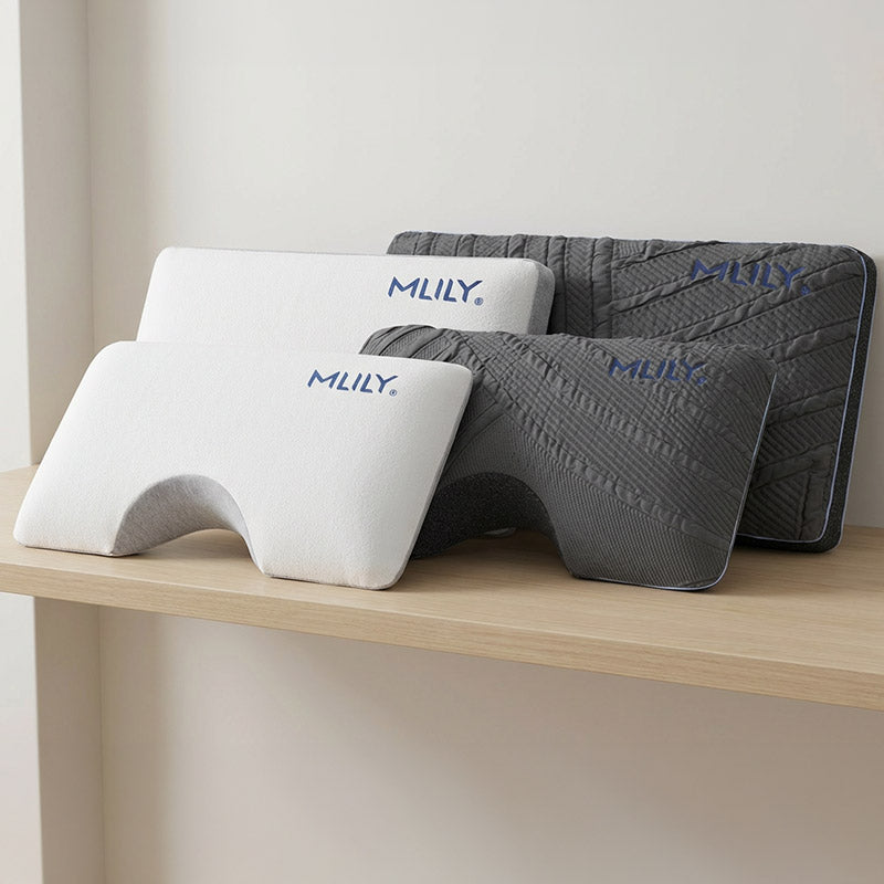 Three MLILY pillows on a wooden surface with a neutral background