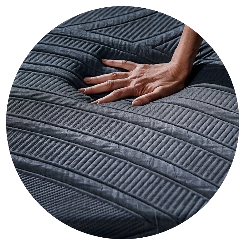 Hand touching a textured gray surface