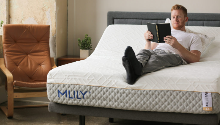 man lounges on MLILY bed with adjustable base