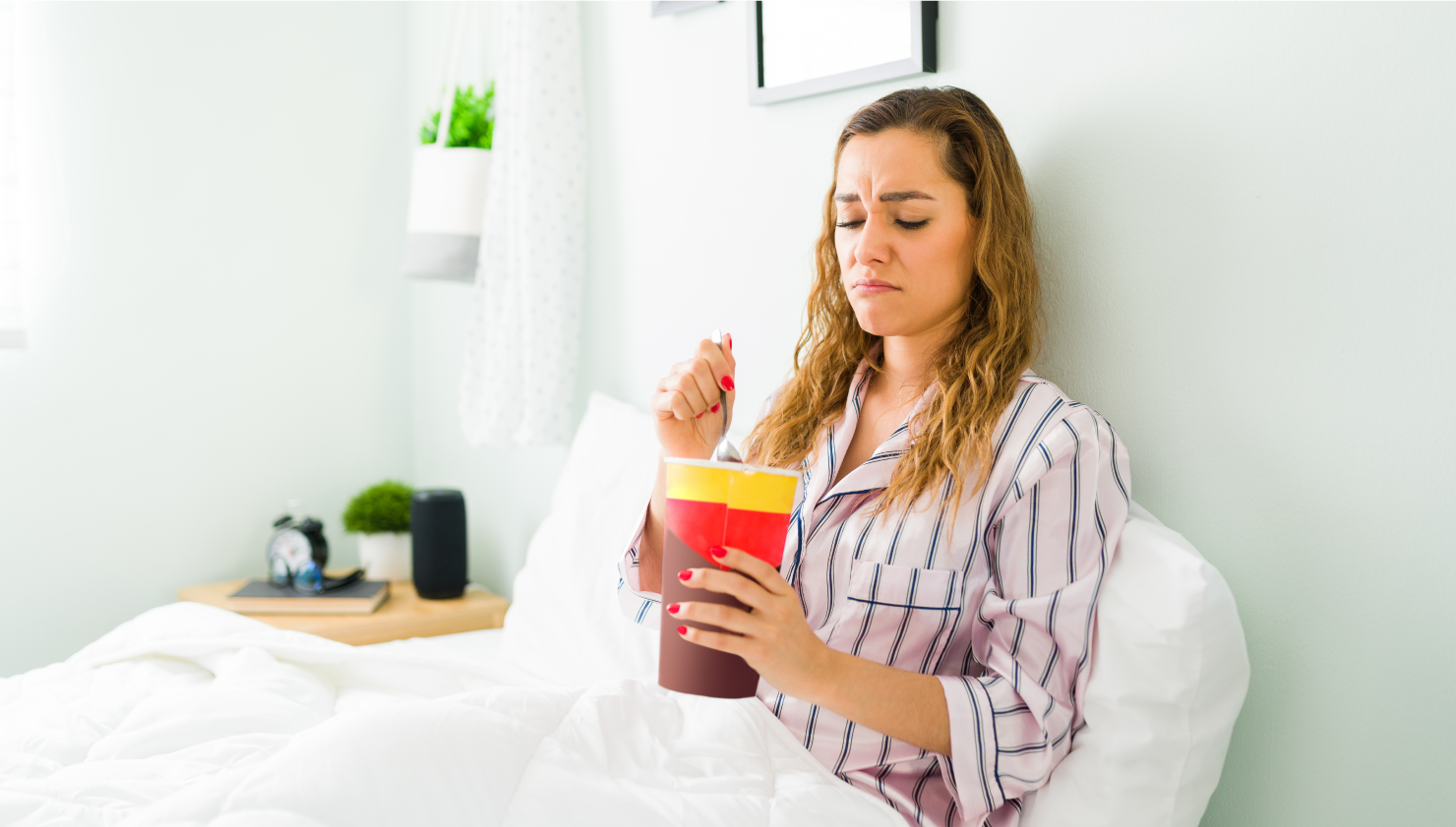 Girl in bed with sugary drink