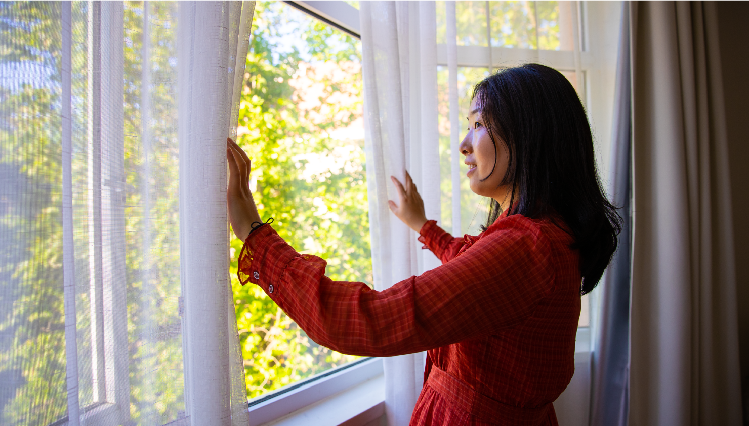 Woman pondering leaving her window open