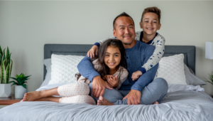 Family in bed excited for the holidays