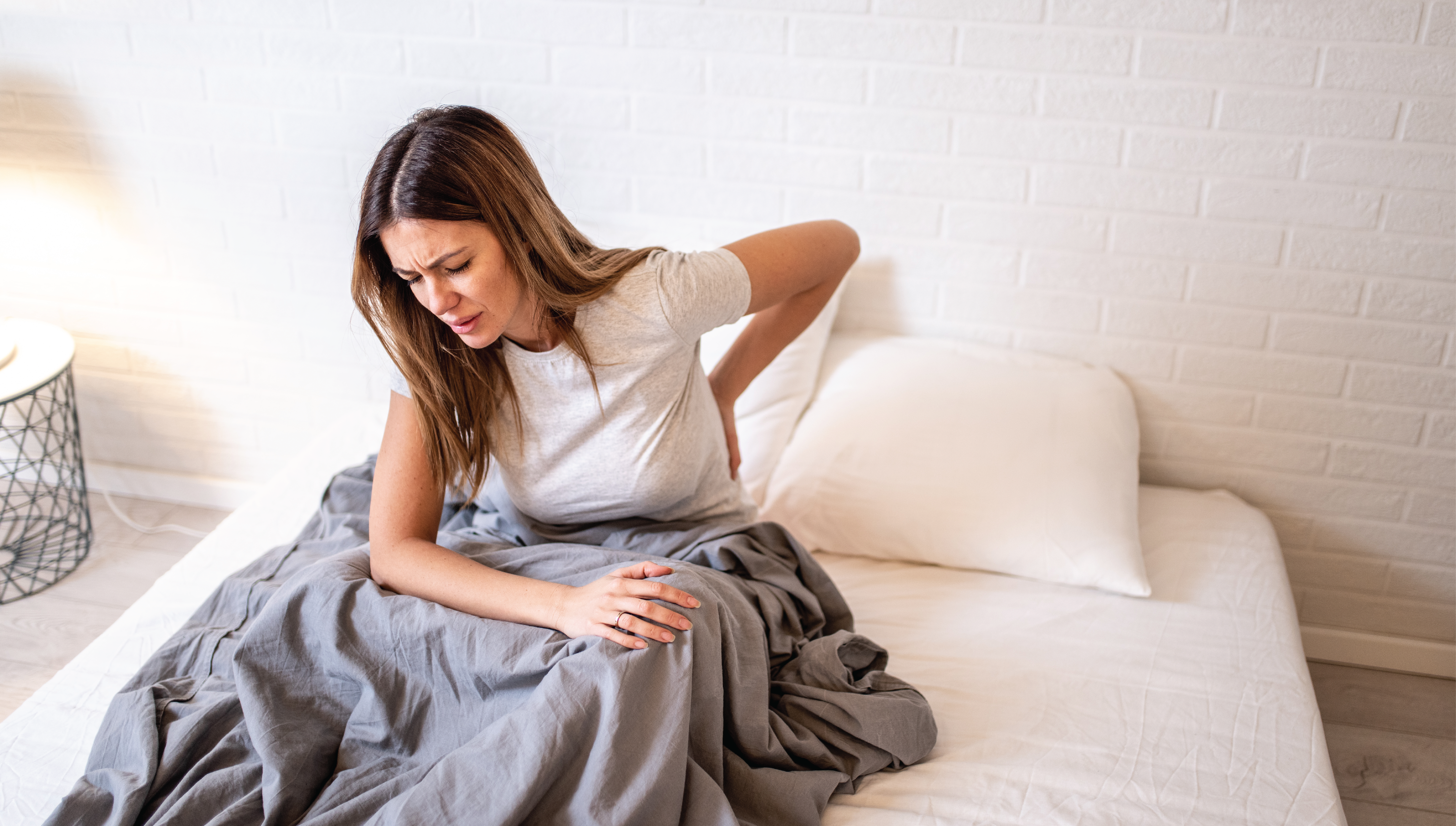 woman needing best mattress for back and hip pain
