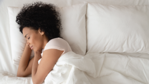 woman sleeping better from white noise sounds